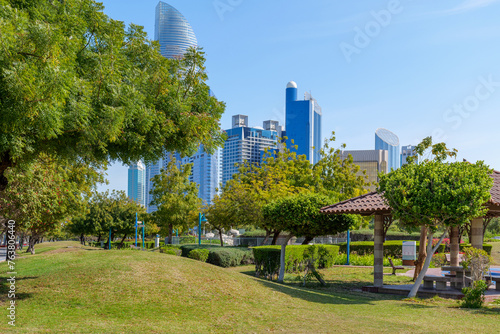 beautiful green Corniche park in Abu Dhabi, UAE overlooking the skyscrapers of the business center