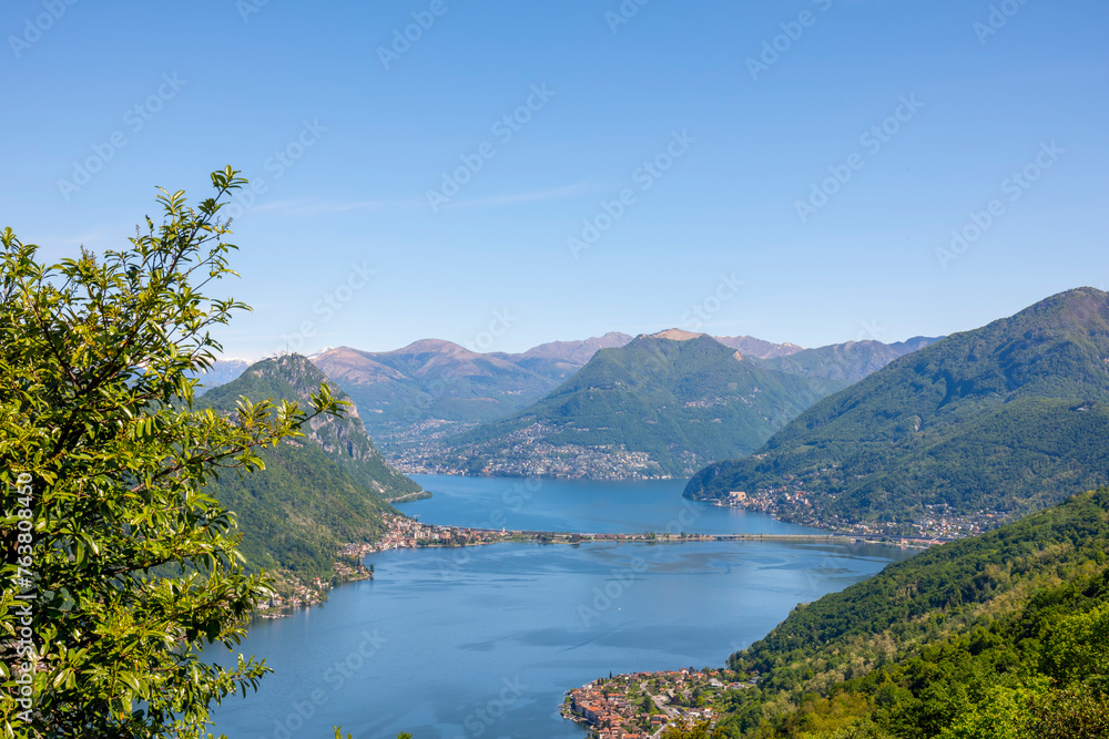 Aerail View over Lugano with Alpine Lake and Mountain in a Sunny Day in Ticino, Switzerland.
