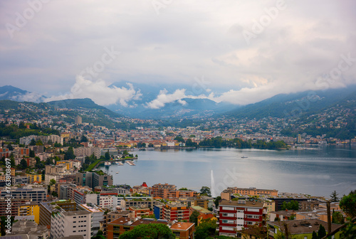 Cityscape and Mountain and Lake Lugano in a Cloudy Day in Ticino, Switzerland.