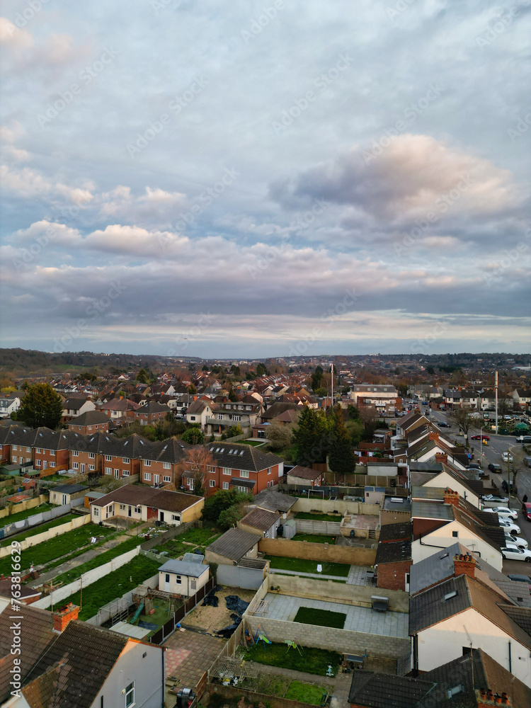 Fototapeta premium Aerial View of Residential Homes During Orange Sunset over England UK