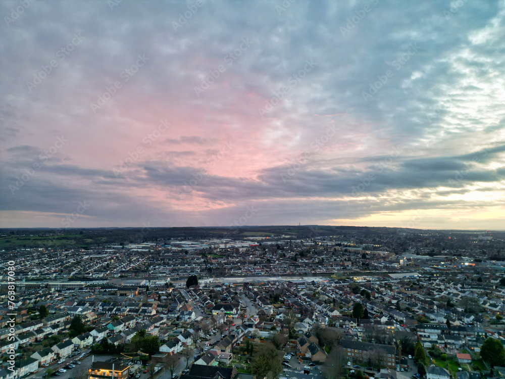 Fototapeta premium Aerial View of Residential Homes During Orange Sunset over England UK