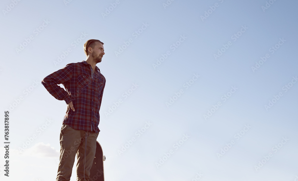 Skateboard, thinking and man at a skate park with idea for trick, stunt or adrenaline sports on blue sky background. Planning, calm and male skateboarder with reflection, questions or memory on ramp Skateboard, thinking and man at a skate park with idea for trick, stunt or adrenaline sports on blue sky background. Planning, calm and male skateboarder with reflection, questions or memory on ramp