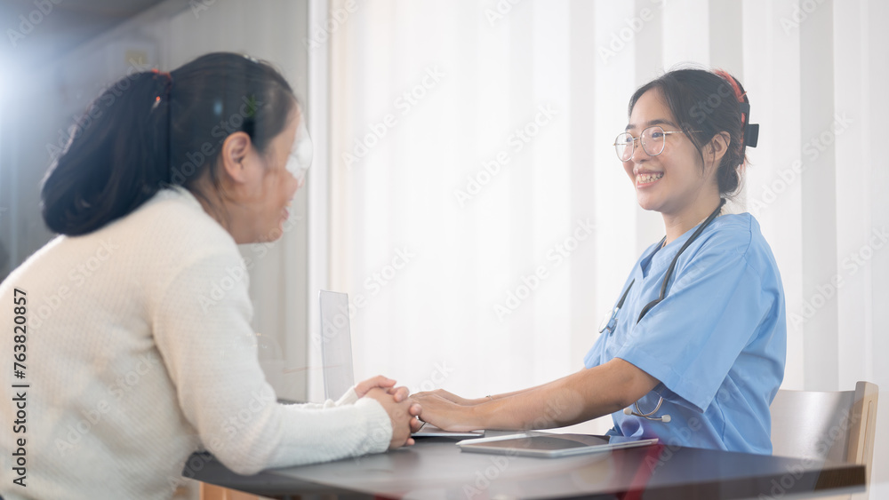 Fototapeta premium A professional Asian female doctor is consulting a female patient in the office at the hospital.