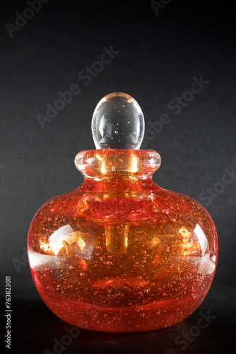 Close-up of an orange glass bottle