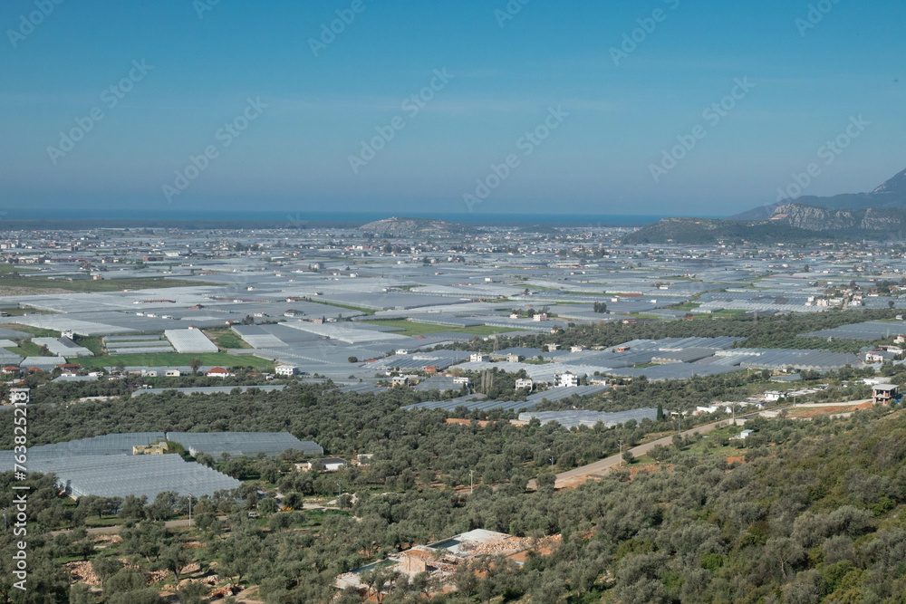Tomato greenhouses are seen from the Lycian Way, Patara, Turkey 