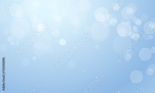 Vector blue background with glowing sparkle bokeh