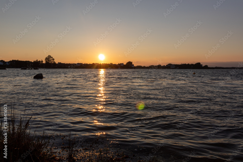 Naklejka premium sunset over the river