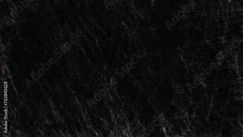 old film cinematic backdrop , loader film reel 35 mm with burned leaks background , old tv style vintage overlay,old filmstrip grunge black background,Noise, dust and grain on old damaged film surface photo
