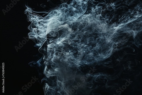 Smoke artfully takes the shape of a human profile in a stunning display of smoky wisps against a dark backdrop.