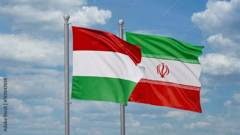 Iran and Hungary two flags waving together on blue sky, looped video Iran and Hungary two flags waving together on blue sky, looped video