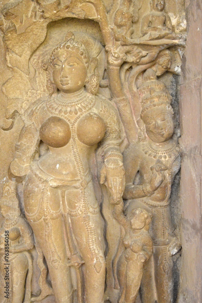 Elaborate and precise carvings in sculptures are intricate works of art created from a diverse range of materials, showcasing enchanting shapes and textures at khajuraho group of monuments, India Elaborate and precise carvings in sculptures are intricate works of art created from a diverse range of materials, showcasing enchanting shapes and textures at khajuraho group of monuments, India