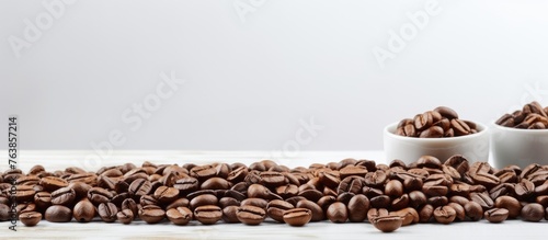 A pile of coffee beans on a wooden table © Ilgun