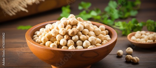Bowl of chickpeas and parsley beside makhana superfood photo