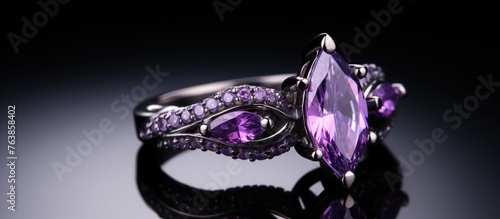 Purple stone ring with marquise cut and black band