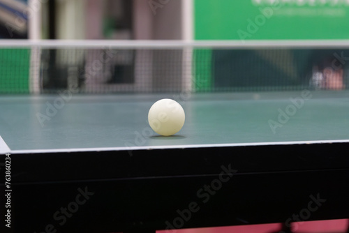 Table tennis ball on the table - stock photo