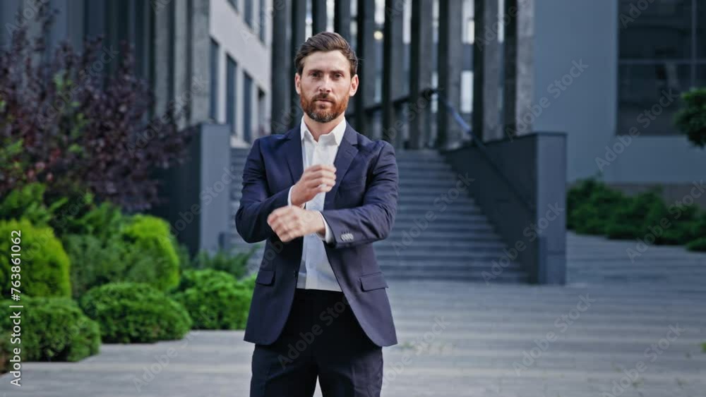 Caucasian man businessman walking near office building successful confident business male entrepreneur leader boss ceo lawyer manager consultant professional employee posing with crossed arms outdoors Caucasian man businessman walking near office building successful confident business male entrepreneur leader boss ceo lawyer manager consultant professional employee posing with crossed arms outdoors