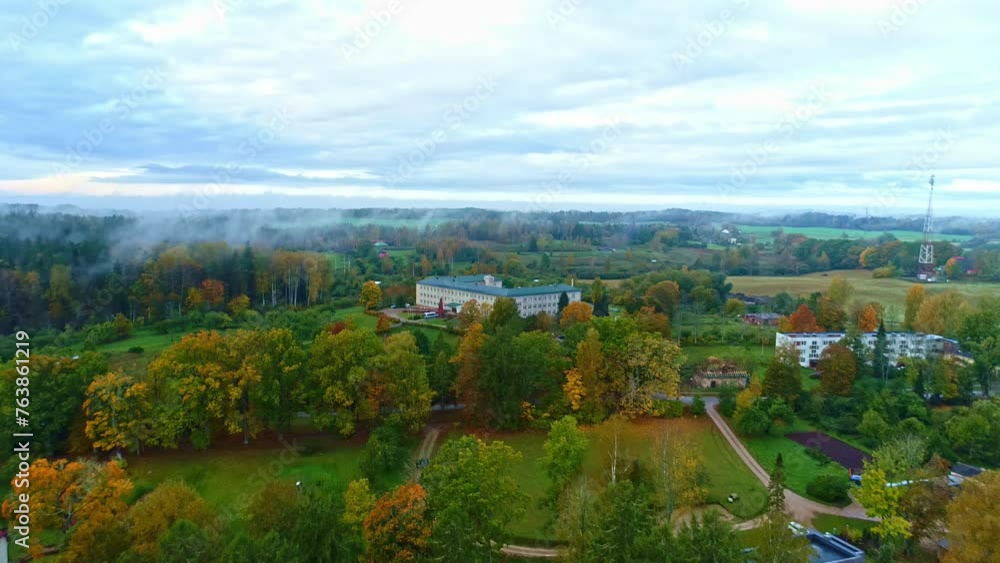 Village houses surrounded by nature late autumn multicolor forest trees Village houses surrounded by nature late autumn multicolor forest trees