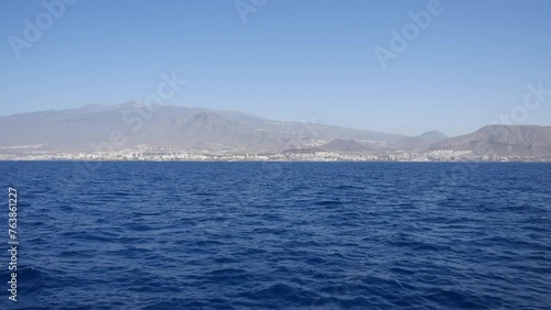 Wallpaper Mural Ocean view with mountainous coastline in the distance, clear blue sky. Scenic seascape, travel destination, coastal cityscape in Tenerife canary islands Torontodigital.ca