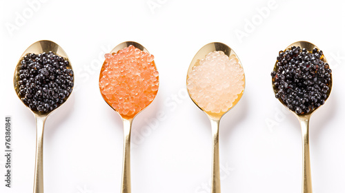 Black and red caviar in golden spoons isolated on white background