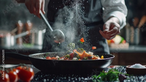 chef adds salt to steaming hot pan in grande cuisine idea for hotel with advertising space