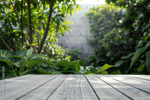 Weathered white wooden table with garden background. Outdoor living design mockup with copy space. High quality photo