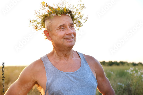 Photos happy cool satisfied trendy funky hipster mature man of 60 years old smiles in T