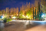 City parking and streets at night in Granada along Alcazaba entrance