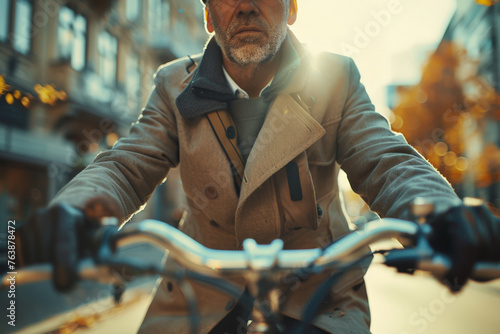 Stylish Senior Man Riding a Bicycle in the City photo