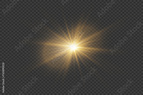 Golden light effect. A flash of starlight and sun rays. On a transparent background.