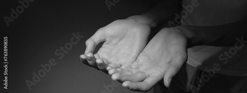 a black and white banner with a place for the inscription two hands palms up