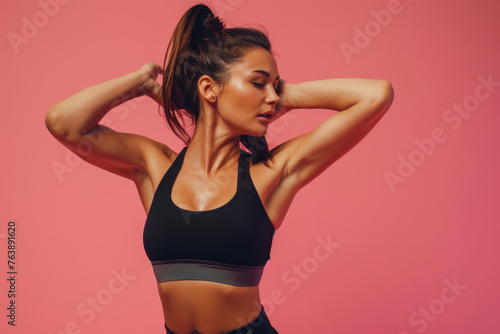 Fitness Workout. Young Woman Doing Bicycle Crunch Abs Exercise Over Pink Studio Background © Kien