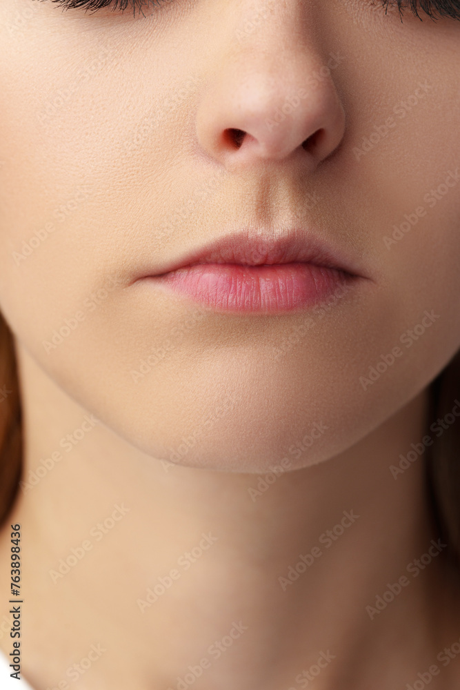 Obraz premium Close up of a young woman with nude make up