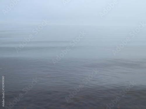 morning fog over the lake, smooth water, silence, white and gray gradient background