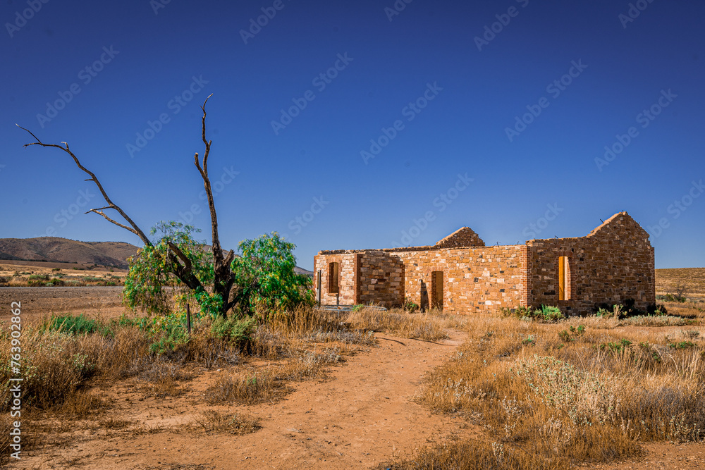 Abandoned Outback Building Amidst Harsh Landscape