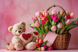 teddy bear with pink flowers in basket 