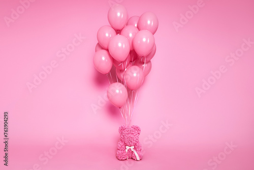 Set of Air Balloons. Bunch of pink color balloons and pink  teddy bear  isolated on pink background. Love. Holiday celebration. Valentine's Day party decoration.