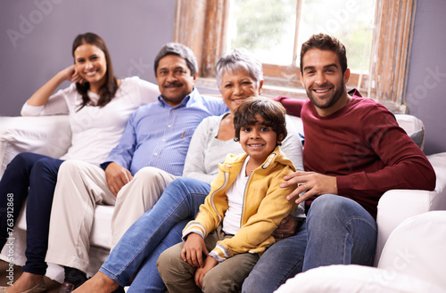 Portrait of grandparents, parents and child on sofa for bonding, relationship and relax together. Big family, happy and mother, father and young boy with seniors for holiday, vacation and weekend