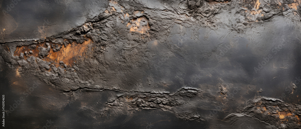 Obraz premium Rustic black surface with orange rust for textured and grunge backgrounds