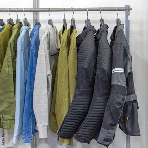 Cotton Shirts Denim Hoodie and Jackets Hanging at Railing Man Fashion Clothing