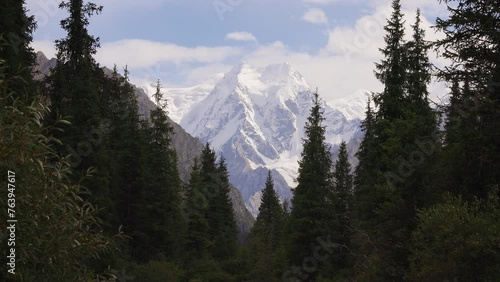 View of the high peak of the Tian Shan mountain range towards Boris Yeltsin Peak, Kyrgyzstan, near the Jeti Oguz Valley photo