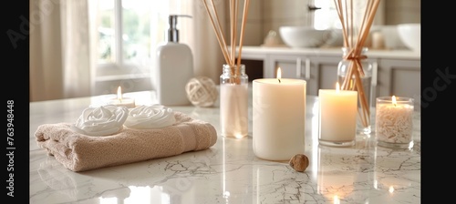 Tranquil spa setting with lit candles and aromatic reed diffuser on table, soft focus background