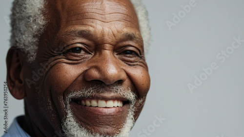 Dark-skinned happy elderly man.