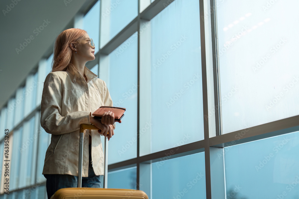 Fototapeta premium Airport travel and woman with passport, flight ticket or information of immigration, journey and luggage. identity document and international registration