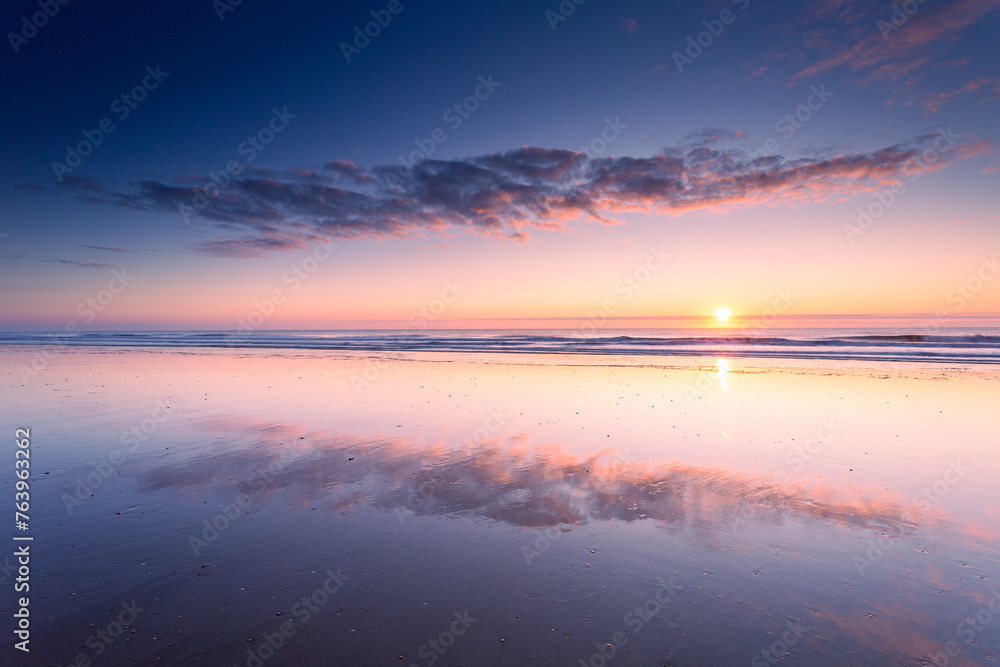 Scenic view of a tranquil sea at sunset