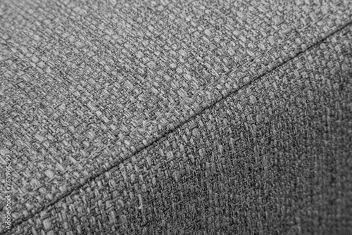 Textured grey furniture fabric with stitching
