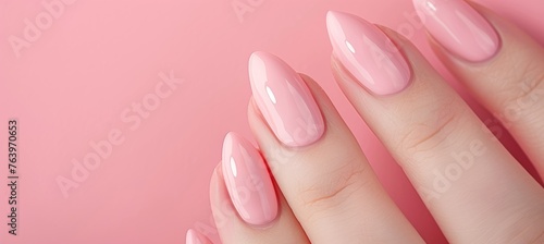 Detailed close up of woman s hand with chic pink nail polish for a glamorous look