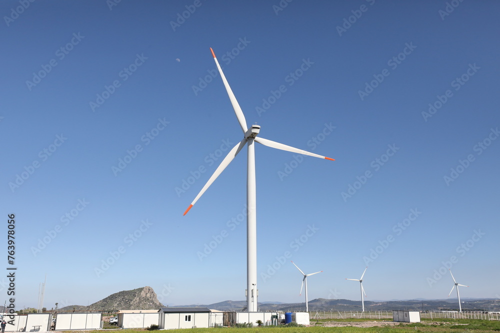 A wind turbine is a device that converts the kinetic energy of wind into electrical energy. A wind turbine is a device that converts the kinetic energy of wind into electrical energy.