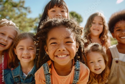 A group of multiethnic children standing outdoors, Children's Day concept.
