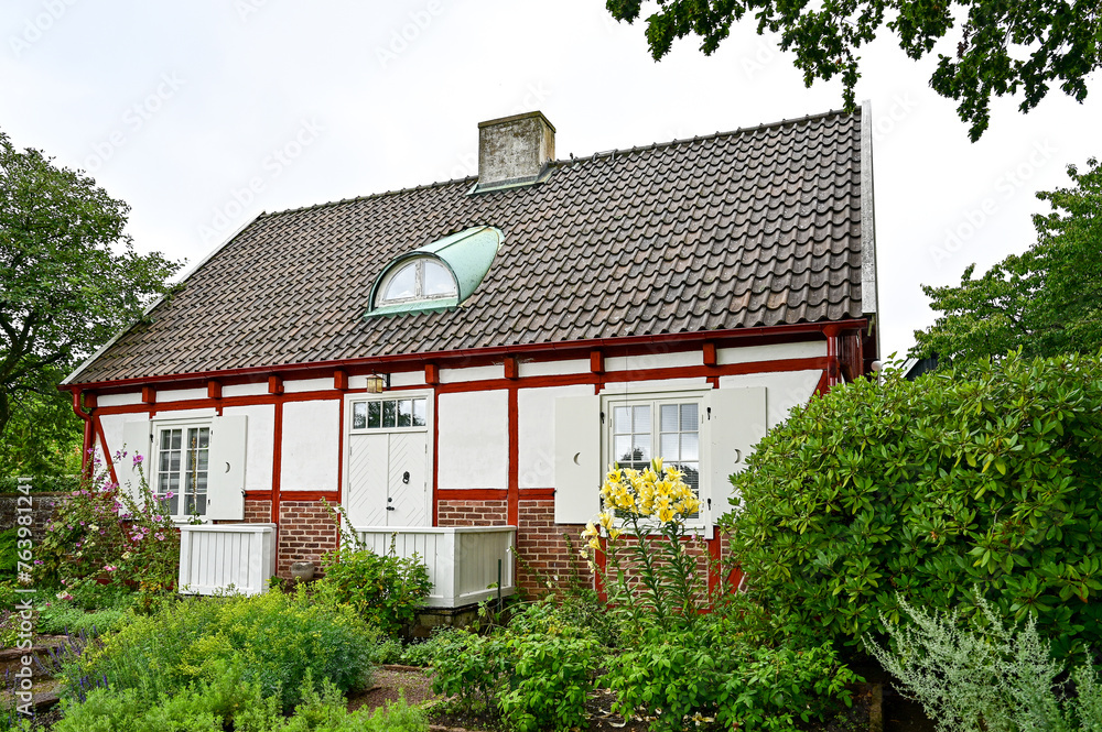 Gardener's house, residential building with a white facade and red half-timbering in the Sofiero Palace Gardens park in the Sofiero Castle, Sofiero Slott och Slottsträdgard in Helsingborg, Sweden	

