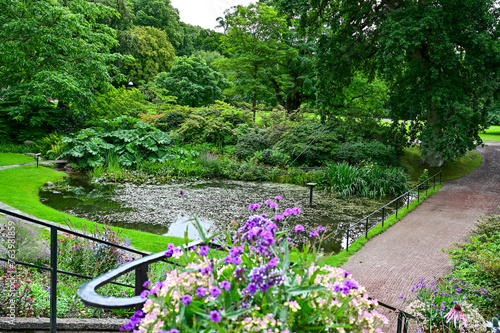 Sofiero Palace Gardens, green park with paths and large trees in Sofiero Castle, Sofiero Slott och Slottsträdgard as a tourist attraction in Helsingborg, Sweden	
 photo